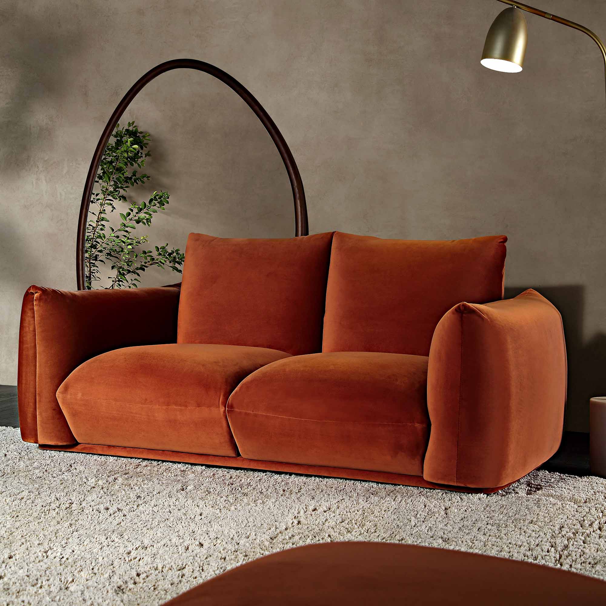 Two Seater Sofa in Rust Velvet with Sleek Armrests